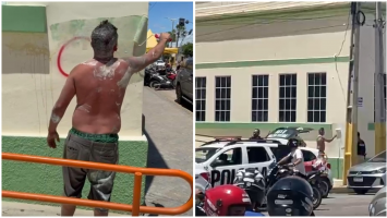 Homem preso por pichar prédios com símbolos de facção pinta muro diante da polícia